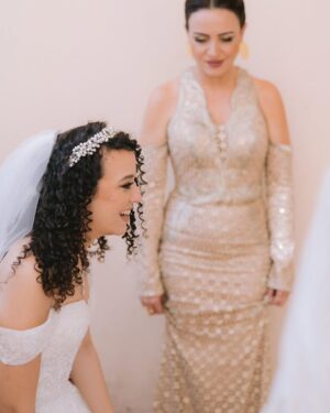 Riham Abdel Ghafour Instagram - My gorgeous niece got married to this wonderful man
God bless you habaybiiii
IsA endless love and happiness 🤍🤍
@mennaraafat 
@mostafayelaidy 
My look
Dress @temraza 
Jewelry @dimajewellery 
Make up @farag_dahy82 
Hair @mahmoud_hair_stylist 
thank you @elmawardyjewelry 
  for making our bride shines even more 💎