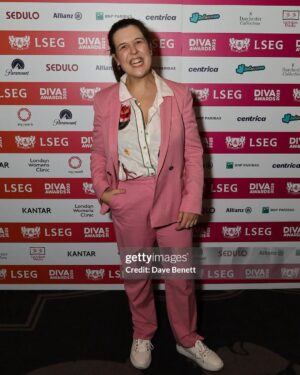 Rosie Jones Instagram - I can’t tell you how much it meant to me to win queer comedian of the year at last night’s @divamagazine Awards. So proud to have @aislingo by my side too. Right hand man FOR LIFE. I’ve come a long way from being a little girl who had feelings for other girls but had no idea how to be disabled AND gay. Representation matters. Compassion matters. Lifting up and supporting the entire queer community matters. I will continue to be a loud little lesbian who shouts loudly and proudly about my love for our entire family, especially during these scary times. Love to all 🏳️‍🌈🏳️‍⚧️