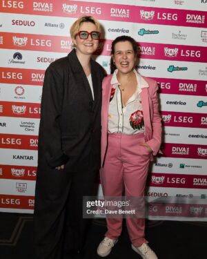 Rosie Jones Instagram - I can’t tell you how much it meant to me to win queer comedian of the year at last night’s @divamagazine Awards. So proud to have @aislingo by my side too. Right hand man FOR LIFE. I’ve come a long way from being a little girl who had feelings for other girls but had no idea how to be disabled AND gay. Representation matters. Compassion matters. Lifting up and supporting the entire queer community matters. I will continue to be a loud little lesbian who shouts loudly and proudly about my love for our entire family, especially during these scary times. Love to all 🏳️‍🌈🏳️‍⚧️