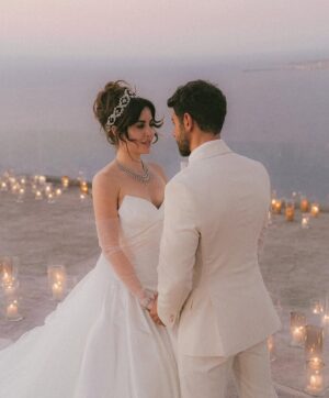 Sara Abi Kanaan Instagram - “I will love you till the end of time”. 
From the magical wedding day of Sara and Wissam ✨

Bride’s look:
Dress: @antoinekarehcouture
Jewelry: @nsoulijewelry
Hair: @simonelmendelek
Bouquets & headpieces: @bbloomed.lb
Stylist @sarah.keyrouz
Makeup: @makeupbyomz
Lashes: @linesbybaniahaidar
Heels: @giva_bygiovannie
 
Groom’s look:
Suit: @maison.eliomoussallem

Wedding planner: @eyecandy_events @linasarkisian @avosofian
Catering: @saveursdumondecatering
Flowers: @casadelflora
Photography: @lens.tales
Cadeau de retour: @sayitwithchocolate_lb
Furniture: @etsrabihm
Interactive wedding stations: @rarevents.lb
Hostesses: @selectagency
Venue: @eternityhamatvillage
PR&Media: @yasminesharawneh
DJ: @dj.eyli
Lighting & Sound: @skylightlebanon