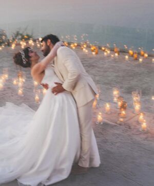 Sara Abi Kanaan Instagram - “I will love you till the end of time”. 
From the magical wedding day of Sara and Wissam ✨

Bride’s look:
Dress: @antoinekarehcouture
Jewelry: @nsoulijewelry
Hair: @simonelmendelek
Bouquets & headpieces: @bbloomed.lb
Stylist @sarah.keyrouz
Makeup: @makeupbyomz
Lashes: @linesbybaniahaidar
Heels: @giva_bygiovannie
 
Groom’s look:
Suit: @maison.eliomoussallem

Wedding planner: @eyecandy_events @linasarkisian @avosofian
Catering: @saveursdumondecatering
Flowers: @casadelflora
Photography: @lens.tales
Cadeau de retour: @sayitwithchocolate_lb
Furniture: @etsrabihm
Interactive wedding stations: @rarevents.lb
Hostesses: @selectagency
Venue: @eternityhamatvillage
PR&Media: @yasminesharawneh
DJ: @dj.eyli
Lighting & Sound: @skylightlebanon