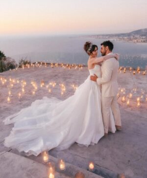 Sara Abi Kanaan Instagram - “I will love you till the end of time”. 
From the magical wedding day of Sara and Wissam ✨

Bride’s look:
Dress: @antoinekarehcouture
Jewelry: @nsoulijewelry
Hair: @simonelmendelek
Bouquets & headpieces: @bbloomed.lb
Stylist @sarah.keyrouz
Makeup: @makeupbyomz
Lashes: @linesbybaniahaidar
Heels: @giva_bygiovannie
 
Groom’s look:
Suit: @maison.eliomoussallem

Wedding planner: @eyecandy_events @linasarkisian @avosofian
Catering: @saveursdumondecatering
Flowers: @casadelflora
Photography: @lens.tales
Cadeau de retour: @sayitwithchocolate_lb
Furniture: @etsrabihm
Interactive wedding stations: @rarevents.lb
Hostesses: @selectagency
Venue: @eternityhamatvillage
PR&Media: @yasminesharawneh
DJ: @dj.eyli
Lighting & Sound: @skylightlebanon