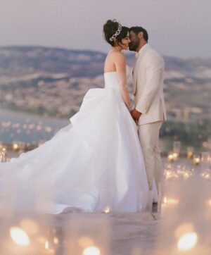 Sara Abi Kanaan Instagram - “I will love you till the end of time”. 
From the magical wedding day of Sara and Wissam ✨

Bride’s look:
Dress: @antoinekarehcouture
Jewelry: @nsoulijewelry
Hair: @simonelmendelek
Bouquets & headpieces: @bbloomed.lb
Stylist @sarah.keyrouz
Makeup: @makeupbyomz
Lashes: @linesbybaniahaidar
Heels: @giva_bygiovannie
 
Groom’s look:
Suit: @maison.eliomoussallem

Wedding planner: @eyecandy_events @linasarkisian @avosofian
Catering: @saveursdumondecatering
Flowers: @casadelflora
Photography: @lens.tales
Cadeau de retour: @sayitwithchocolate_lb
Furniture: @etsrabihm
Interactive wedding stations: @rarevents.lb
Hostesses: @selectagency
Venue: @eternityhamatvillage
PR&Media: @yasminesharawneh
DJ: @dj.eyli
Lighting & Sound: @skylightlebanon