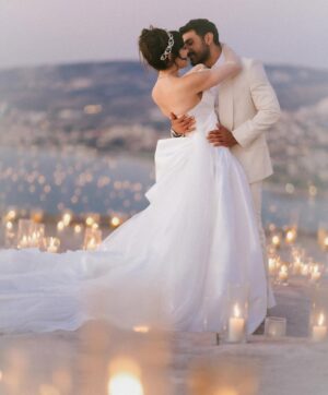 Sara Abi Kanaan Instagram - “I will love you till the end of time”. 
From the magical wedding day of Sara and Wissam ✨

Bride’s look:
Dress: @antoinekarehcouture
Jewelry: @nsoulijewelry
Hair: @simonelmendelek
Bouquets & headpieces: @bbloomed.lb
Stylist @sarah.keyrouz
Makeup: @makeupbyomz
Lashes: @linesbybaniahaidar
Heels: @giva_bygiovannie
 
Groom’s look:
Suit: @maison.eliomoussallem

Wedding planner: @eyecandy_events @linasarkisian @avosofian
Catering: @saveursdumondecatering
Flowers: @casadelflora
Photography: @lens.tales
Cadeau de retour: @sayitwithchocolate_lb
Furniture: @etsrabihm
Interactive wedding stations: @rarevents.lb
Hostesses: @selectagency
Venue: @eternityhamatvillage
PR&Media: @yasminesharawneh
DJ: @dj.eyli
Lighting & Sound: @skylightlebanon