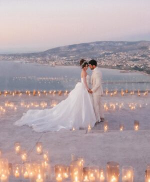 Sara Abi Kanaan Instagram - “I will love you till the end of time”. 
From the magical wedding day of Sara and Wissam ✨

Bride’s look:
Dress: @antoinekarehcouture
Jewelry: @nsoulijewelry
Hair: @simonelmendelek
Bouquets & headpieces: @bbloomed.lb
Stylist @sarah.keyrouz
Makeup: @makeupbyomz
Lashes: @linesbybaniahaidar
Heels: @giva_bygiovannie
 
Groom’s look:
Suit: @maison.eliomoussallem

Wedding planner: @eyecandy_events @linasarkisian @avosofian
Catering: @saveursdumondecatering
Flowers: @casadelflora
Photography: @lens.tales
Cadeau de retour: @sayitwithchocolate_lb
Furniture: @etsrabihm
Interactive wedding stations: @rarevents.lb
Hostesses: @selectagency
Venue: @eternityhamatvillage
PR&Media: @yasminesharawneh
DJ: @dj.eyli
Lighting & Sound: @skylightlebanon