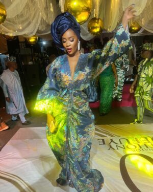 Toni Tones Instagram - Queening! ✨ 

Celebrated my dad’s birthday in style! 💙🎉

And one thing about me? My gele is ALWAYS going to gele, hunnay! 💁🏽‍♀️✨”

Obsessed with my fabulous Asoebi 😍 — this Japanese-inspired kimono dress made by the incredible @adeysoile 😍❤️🔥