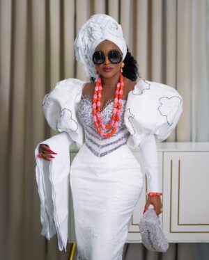 Ini Edo Instagram - Finally, I laid to rest my first love .A man whose presence shaped our lives in ways words can barely capture. Our father was more than just a provider and protector—he was a guiding light, a man who walked with unwavering faith and instilled in us the fear of God.

He taught us that life is more than just what we see; that our actions, our words, and even our thoughts should align with the will of God. He led by example, showing us the power of prayer, the importance of integrity, and the value of humility. Through his discipline, we learned respect. Through his wisdom, we gained understanding. And through his love, we found strength.

He was not a perfect man, but he was a man after God’s own heart—one who believed that righteousness was the foundation of a meaningful life. His voice still echoes in our hearts, reminding us to trust in the Lord, to walk the straight path, and to never forget where we come from.

Though he may no longer be with us, his legacy lives on. The seeds of faith he planted in our hearts continue to grow, shaping the way we live, love, and serve.

We thank God for the gift of our father, a man who feared the Lord and taught us to do the same. His work on earth is done, but his impact will never fade. Rest well, Dad, until we meet again in the presence of the One you taught us to honor…. Adieu Daddy, Asiere Daddy .. till we meet again…

Styled @medlinboss 
Couture outfit @medlincouturecollection
Gele _gabby_gele 
Videography @_kelvzsshot