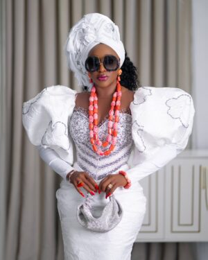 Ini Edo Instagram - Finally, I laid to rest my first love .A man whose presence shaped our lives in ways words can barely capture. Our father was more than just a provider and protector—he was a guiding light, a man who walked with unwavering faith and instilled in us the fear of God.

He taught us that life is more than just what we see; that our actions, our words, and even our thoughts should align with the will of God. He led by example, showing us the power of prayer, the importance of integrity, and the value of humility. Through his discipline, we learned respect. Through his wisdom, we gained understanding. And through his love, we found strength.

He was not a perfect man, but he was a man after God’s own heart—one who believed that righteousness was the foundation of a meaningful life. His voice still echoes in our hearts, reminding us to trust in the Lord, to walk the straight path, and to never forget where we come from.

Though he may no longer be with us, his legacy lives on. The seeds of faith he planted in our hearts continue to grow, shaping the way we live, love, and serve.

We thank God for the gift of our father, a man who feared the Lord and taught us to do the same. His work on earth is done, but his impact will never fade. Rest well, Dad, until we meet again in the presence of the One you taught us to honor…. Adieu Daddy, Asiere Daddy .. till we meet again…

Styled @medlinboss 
Couture outfit @medlincouturecollection
Gele _gabby_gele 
Videography @_kelvzsshot