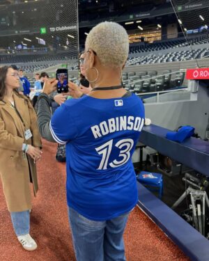 Karen Robinson Instagram - Y’all - what even is my life??? Number eleventy seven thousand on Things I Didn’t Even Know I Had On My 🪣Bucket🪣 List!!!

Thank you ⚾️ @bluejays  for having li’l ol’ can’t-throw-can’t-catch me as your Ceremonial First Pitcher. No one important was maimed, and I did not humiliate myself, and adorbs @mason.fluharty took my acting notes and pitched like a champ, and WE WON!!!!🎉🎉🎉 (Y’all welcome😁)

Best of all - I got to hang with my @lawandorderto peeps - @kccollinsworld (and kid), @stephenacshinn (from @larkproductions ), and @alessiastaff and #kalestockwell (🙏🏽for taking such good care of us, @rogers ). *** @j_mcintyre5 missed my first pitch because 🍤🍱🍔, and I told him I was gonna tell EVERYBADDY!!!***

Finally, I showed up “jersey cute” because
💋 @lady_kerry
🧑🏼‍🦱@lorrij_texturedbeauty

🙏🏽🙏🏽🙏🏽⚾️🧢🇨🇦❤️🙏🏽🙏🏽🙏🏽