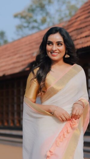 Nimmy Arun Gopan Instagram - Presenting the first from “തങ്കക്കണി”, our Vishu series – a beautiful Handloom Mul Mul Cotton Kerala Kasavu Saree 🤍✨. 

Light as a cloud, soft as a dream, and woven with tradition that feels like home.

A saree that speaks of simplicity, elegance, and the stories we carry. 🌿

💫 A Limited Edition classic—get yours before it’s gone. 🌿

DM us or WhatsApp at  91 90370 48009 to order.

#naayika #naayikabynimmyarungopan 
#vishuedition #handloomsaree #limitededition 
#timelesselegance