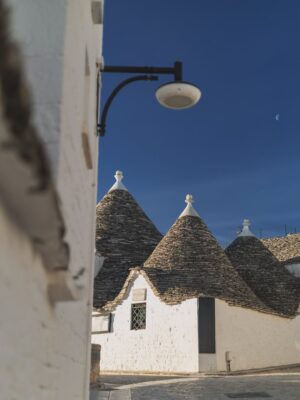 Rebecca Roy Instagram - 📍Alberobello in one magical morning!

This UNESCO World Heritage town in Puglia is famous for its Trulli — cone-roofed houses built entirely without mortar. These stone homes date back to the 14th century and were once designed to be easily dismantled to avoid taxes!

In just a few hours, we:
• Wandered through quiet Trulli lanes under the morning moon
• Learned about their fascinating architecture and history
• Explored charming local shops inside the Trulli
• Tried local wines, fig jams & olive oil
• Soaked in that golden morning light that made the whole town glow

Tip: We stayed in an actual Trulli at @tipicoresortalbergo — and highly recommend spending a night (or two!) here instead of doing a day trip.
Waking up early and catching the peaceful streets before the crowds arrive? 100% worth it.

Travel by @gtholidays.in 

All content is self shot 

#Alberobello #TrulliExperience #PugliaTravel #UNESCOWorldHeritage #coupletravel #ItalyHiddenGems #TipicoResort #TrulliStay #SlowTravelEurope #AlberobelloTips #chennaiinfluencer