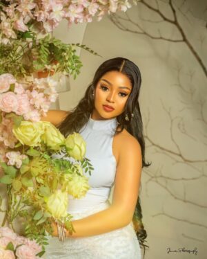 Regina Daniels Instagram - Na money wey go make me craze na e I Dey find now 🤭 

Dress: @regaeofficial 
Mua: @zaraleinadsignature 
Hair styled: @styledby_earlymomo1 
📷: @jamesphotography2 

Skin : @susanchanelbeauty