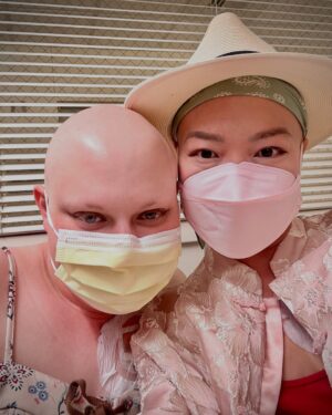 Shirley Chung Instagram - Hey Aubryn, my love, my light, my warrior sister, Rest in Power 💜🖤 i still can’t believe you are gone so soon.  I am sorry I didn’t heal fast enough to go on our girl trip to NY with you. 💛 You were so loud, bright and animated just like me, the first time we smiled at each other in the radiation room I knew we will be friends for life, I just wish we had more time……. We were the girls never shut up, always giggling at 7am for radiation, coordinating outfits even when our neck and face were covered with blisters. Yesss, we were those tongue cancer patients who won’t stop talking about food!! 🖤 During my darkest most painful moments, I never lost hope, because I had you, you understood, you were fighting right next to me.❤️We were so loved and popular on 10th floor oncology wards, nurses even timed our chemo together, so we could spend extra hours in each other’s room. I still have all the sticky notes you wrote to me when we couldn’t talk.📝And I hope UoC will really roll out their cancer patients companions program inspired by our friendship like they said, continue your legacy💜 I am going to keep a piece of you in my heart forever, take you to all the places that we said we are going to visit,go to all the restaurants we saved in NY for our girl trip.  Mike said he will find your list of food carvings you wrote when we were in the hospital for me, and I will cook and eat through that list for you.🤍I am going to live fuller, love harder, fear less, laugh even louder. I know you are in heaven looking down, continuing to protect me, my fierce beautiful angel.  I Love you ❤️ 👯‍♀️ #fuckcancer #tonguecancer #cancerwarrior #gonetoosoon #neverlosehope #cancerfighter #cancerjourney #aubrynwatts #rip