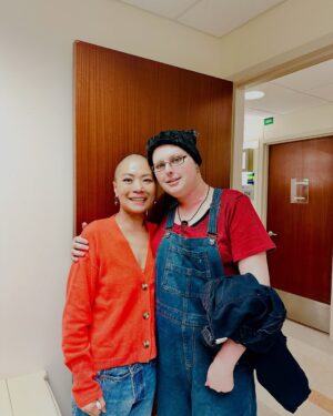 Shirley Chung Instagram - Hey Aubryn, my love, my light, my warrior sister, Rest in Power 💜🖤 i still can’t believe you are gone so soon.  I am sorry I didn’t heal fast enough to go on our girl trip to NY with you. 💛 You were so loud, bright and animated just like me, the first time we smiled at each other in the radiation room I knew we will be friends for life, I just wish we had more time……. We were the girls never shut up, always giggling at 7am for radiation, coordinating outfits even when our neck and face were covered with blisters. Yesss, we were those tongue cancer patients who won’t stop talking about food!! 🖤 During my darkest most painful moments, I never lost hope, because I had you, you understood, you were fighting right next to me.❤️We were so loved and popular on 10th floor oncology wards, nurses even timed our chemo together, so we could spend extra hours in each other’s room. I still have all the sticky notes you wrote to me when we couldn’t talk.📝And I hope UoC will really roll out their cancer patients companions program inspired by our friendship like they said, continue your legacy💜 I am going to keep a piece of you in my heart forever, take you to all the places that we said we are going to visit,go to all the restaurants we saved in NY for our girl trip.  Mike said he will find your list of food carvings you wrote when we were in the hospital for me, and I will cook and eat through that list for you.🤍I am going to live fuller, love harder, fear less, laugh even louder. I know you are in heaven looking down, continuing to protect me, my fierce beautiful angel.  I Love you ❤️ 👯‍♀️ #fuckcancer #tonguecancer #cancerwarrior #gonetoosoon #neverlosehope #cancerfighter #cancerjourney #aubrynwatts #rip