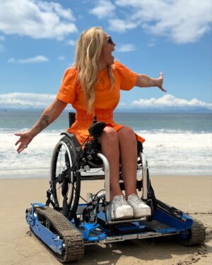 Sophie Morgan Instagram - This is FREEDOM! 

This week, as part of a film I hosted for @visitcalifornia, I was introduced to this extraordinary invention: FreedomTrax (@freedomtrax)

Please have a scroll through these images and videos. 

The FreedomTrax is a manual wheelchair accessory designed to enhance outdoor access accessibility. It’s a battery operated device controlled by a joystick, enabling manual wheelchairs to navigate sand, hiking trails… And even snow!

Thanks to everyone involved in making this happen. This was my FIRST EVER time on a California beach. It was incredibly emotional. 

In Nature Track’s words “we are in the business of making people happy”. Honestly, I can attest, they REALLY are. 

If you want to know more about them please contact Sue (last slide) at @naturetrack_ (if you are in the USA) .They are based in Santa Barbara (but @freedomtrax have a global presence) and best of @naturetrack_ loan them to users ….for FREE. 

Sue@naturetrack.org
Abby@naturetrack.org 

If you want to buy one they cost $6.5k but you can RENT them from @naturetrack_ for nothing. It is available to anyone who uses a wheelchair or requires assistance accessing outdoor spaces. If you don’t have a manual wheelchair NatureTrack can lend you one (I assume, USA only - please contact them to find out). 

#NatureTracks #FreedomTracks #Wheelchair #Beach #Wheelchair #AdaptiveEquipment #BeachLife #California #AdaptiveFreedom 

THIS IS NOT AN AD. I AM NOT PAID FOR THIS POST. I AM NOT AFFILIATED TO THIS PRODUCT OR COMPANY.