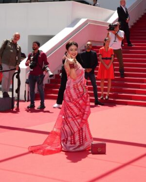 Ashna Habib Bhabna Instagram - The moment I received the invitation to walk the red carpet at Cannes, I knew I wanted to make a statement with my outfit. As I sifted through my wardrobe, trying to find the perfect ensemble, my gaze fell upon my mother’s wedding saree. Instantly, I felt a surge of emotion - this saree wasn’t just a piece of fabric, it was a symbol of love, tradition, and my parents’ blessings.
In that moment, I knew that there was no other outfit that could compare to the significance and sentimentality of my mother’s red saree. It was more than just a garment, it was a connection to my roots, my family, and my heritage. And so, without hesitation, I decided to wear it for my special day at Cannes.
As I walked the red carpet in my mother’s saree, I felt a sense of pride and gratitude. Not only was I representing myself, but I was also honoring my mother, my family, and all the love and support they had given me throughout my life. The saree draped around me like a protective shield, reminding me of where I came from and the values that had shaped me into the person I am today.
So, as I stood there, surrounded by the glitz and glamour of Cannes, I knew that my mother’s red saree was not just a piece of clothing - it was a symbol of love, strength, and the bond between mother and daughter. And for that, I will always be grateful….
Jewels @canvas.2603
লাল পলা @6yardsstory