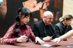 Chloe Chua Instagram - Post- concert autograph session after my Brahms Double Concerto concert with cellist Pei Sian, Maestro Hans Graf and SSO on 26 July ✍️💫