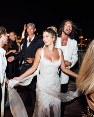 Delta Goodrem Instagram - EXCLUSIVE: Delta Goodrem’s wedding celebrations began with a breathtaking welcome dinner at The Sheer Bastion @cugo_gran_macina in Malta - and we have the first look. From the moment guests arrived to the sound of Frank Sinatra and Nat King Cole, it was clear this wasn’t just any wedding week. It was going to be unforgettable.
Dressed in a custom @antoinettefusillo gown - a soft blush lace creation that “felt like it was dancing with me through the night,” Delta set the tone for a week of love, joy and full dance floors. Paired with pale pink @lanawilkinsonofficial heels, @antonjewellery diamonds and a deep plum lip by makeup artist @nonismithmakeup, the look was pure modern romance. Styled by @meggysmithstylist every detail was effortless elegance.
Guests were treated to flowing champagne, fresh canapés and a live performance from Maltese artist Kevin Paul. “Everyone was dancing and singing up a storm,” Delta tells us. “It was the perfect first chapter.”
Captured by @mattporteous and @becky_lee_brun, with planning by @sarahyoungevents and @thisiswonderevents, these moments were pure magic. Head to the link in bio for every exclusive detail.