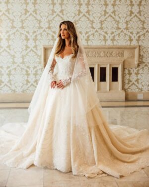 Delta Goodrem Instagram - My @paolo_sebastian dress spoke of our stories, @phoeniciamalta whispered legacy. ❤️ A timeless moment stitched into our forever.
The moments before heading off to the church… we captured this photo outside the hotel, with all the hard working beautiful team at Phoenicia standing there with my girlfriends waving us off. Thank you for making our special week even more special at this historic hotel 🙏🏼❤️