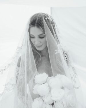 Delta Goodrem Instagram - My @paolo_sebastian dress spoke of our stories, @phoeniciamalta whispered legacy. ❤️ A timeless moment stitched into our forever.
The moments before heading off to the church… we captured this photo outside the hotel, with all the hard working beautiful team at Phoenicia standing there with my girlfriends waving us off. Thank you for making our special week even more special at this historic hotel 🙏🏼❤️