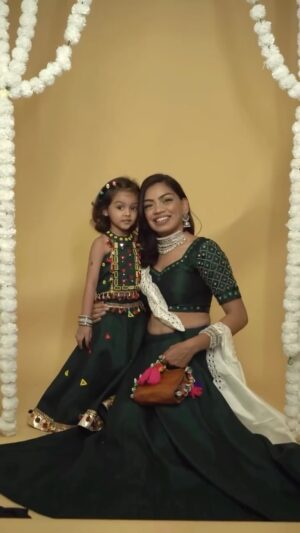 Dixita Patel Instagram - Rate this look out of 10 šš«¶š» twinned with my niece š¤š»šā¤ļøāš„
.
.
#9ratriwithdixi ; For this look I took stitched plain green blouse & lehenga & then did mirror work on the sleeves & blouse border , for Mannats outfit since she loves colours a lot , used 3 contrasting colors to do the mirror work
.
.
Jewellery- @ishhaara š¦¢š¤
Bag - @ohwomaniyaa.in ā¤ļøāš„
.
.
.
.
#twinning #twin #mirrorwork #navratrioutfit #navratri #navratrispecial #navratrilookbook #gujju #gujarati #gujarati #gujaratisong #style #styling #fashion #indowestern #flare #desi #reel #reels #reelsinstagram #reelitfeelit #explore #explorepage #trend #trending #viral #outfitfromscratch #niece #twinningiswinning #nieces