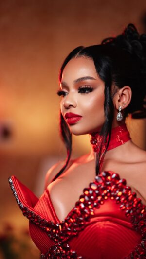 Mihlali Ndamase Instagram - This Valentines, I'm the love story 🌹

Happy Valentine's Day loves! 

Makeup: @mudiglam_ (red looks)
@thepenthousebeautystudio (black & gold look)
Hair: @thepenthousebeautystudio 
Wardrobe: @masangobysiphosihle 
Creative Direction: @conceptcraft_ & @mihlalii_n 
Production: @jabu.pix 
Decor: @kidseventsstyling 
Suite bouquet: @serenepetalsposies 

#ValentinesDay25