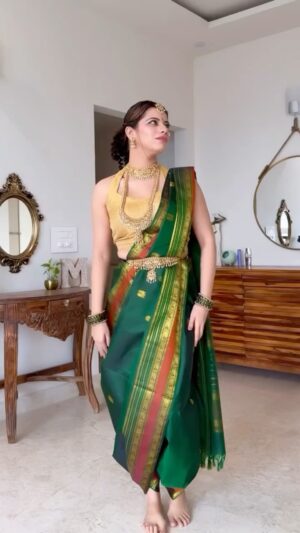 Mili Lakhmani Instagram - From draping my first Navvari saree solo to channeling full-on Kashibai vibes for Ganesh Chaturthiāthis festive journey has been a blast! š
Usually, momās my saree savior, but this time I flew solo and guess what? Totally nailed it! The green saree from @label__sundaridesigns stole my heart š„°plus the Marathi jewelry: oh my god so pretty š„¹āØand that little āmom magicā in spirit made it all come together beautifully.
If I can do it, so can you! Tell me how it looks and drop your festive vibes below. šāØ
#KashibaiMode #GaneshChaturthiReady #MomKnowsBest #grwm #nauvarisareedraping #nauvarisaree #marathilook