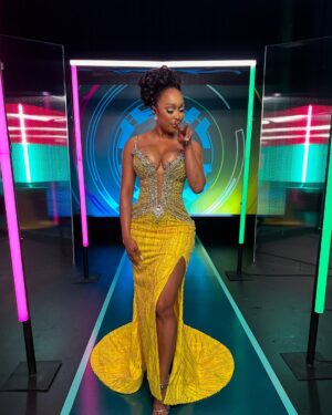 Minnie Dlamini Instagram - You better be watching the #LoveNeverLiesZA reunion Now streaming on @netflixsa 🚀 I had the time of my life ♥️🥹💎
Thank you 🙏🏾 #InternationalHost
Dress: @j_william_aria 🥰