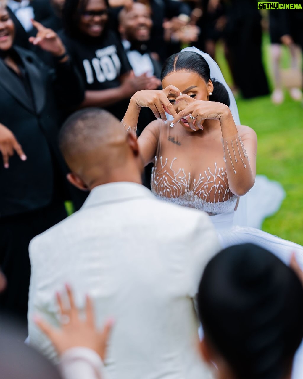 Ntando Duma - 307.5K Likes - “When divine love descends, angels take form in the hearts of those who cherish forever”. My forever arrived in the most precious form - my husband, my best friend, my soulmate. We feel blessed to adorn the cover of @previdarweddings Magazine’s June 2025 issue, sharing our sacred celebration of God’s love with loved ones❤️

Heartfelt gratitude to the dream team who made our day unforgettable:

@Nono_Events - We wouldn’t have given this “tender” 😂 to anyone else but YOU! You brought our vision to life! You are a work of art. Thank YOU!!!🤍

@Geffphotography - You captured our love so beautifully & effortlessly. Thank YOU🤍

@_SunsetCocktails - That bar? As per our request? YOU ATE! Siyabonga 🤍 

@Chefnzuzaofficial - oh my cake boss! You never disappoint! Our cake was a masterpiece, a symphony of taste and beauty. Thank YOU!🤍

@SuitabilityGardens - Your venue was a haven! You sure made our special day a memorable one. Siyabonga 🤍

@Suitability_ - Your tailored suits for MY husband and his men? Top tier! You elevated their elegance, a perfect blend of style and sophistication. Thank you!🤍

@Urbanhair_gallery - You just know how to make one feel like a queen. Thank you for my crown🤍✨

@Mianodesigns - My dress was a dream, a vision that exceeded expectations. Thank you 🤍

@Blackcrownza - That bar brought the perfect finish, sealing our celebration with flair. Our guests couldn’t be more pleased,Thank you!!🤍

Special thanks to those who added magic to our celebration:
@amandablacksa - Your gift and performance were everything and more. Thank you for blessing us🤍

@tondirams - Your one-of-a-kind performance stole our hearts. Precious moments indeed. Thanks bro🤍
 
@muneyi_ - Your angelic voice definitely touched our souls. We’re grateful. Ro livhuwesa🤍

To my incredible bridesmaids ( @iam_khanyi95 @simplymahadi @nadiajaftha - thank you for your love,contribution & support to my special day.I’m eternally thankful!🤍

 @zanelepotelwa - your kindness, dedication, and willingness to be there for us on every special occasion haven’t gone unnoticed. Thank you for being a blessing to our family 🥹❤️#PrevidarWeddingMagazine #LoveStory #WeddingCelebration #NUbeginning