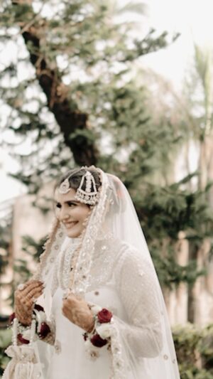 Riya Kishanchandani Instagram - My fav verison of my myself 🫶🏻
📸 - @pageantryproductions
Mua & lashes - @makeover_by_zara
Hair by - @makeoverby_tanzilashaikh
#bride #2023 #white #love #fyp #trendingreels #reels