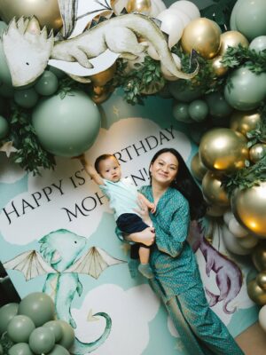 Sharifah Amani Instagram - A whole year with you. Happiest 1st Birthday best friend Mum & Bapak. ✨💚✨
Ya Allah Ya Rahman Ya Rahim,
We are grateful for every smile, every breath, every moment we have with our son Ahmed Mohsein. The grandson to our parents, the nephew to our brothers and sisters, the cousin to our nephews and nieces, the apple of our eye.
With deep gratitude. As a sign of our love and affection for him, we ask of You Allah, to bless him with a life filled with Your mercy, strong faith, a mind that’s thoughtful, good health, and endless sustenance that is pure and full of Your blessings.
Ya Allah Ya Ghafur Ya Wadud
Protect him always, in ways we see and ways we don’t. Fill his heart with faith, kindness, and courage. Let him grow into someone who brings good to others and walks a path that pleases You.
Grant him strength in hardship, humility in ease, and joy in worship. Surround him with love, guide his steps, and let him never feel alone.
Ya Allah Ya Karim Ya Razzaq
We entrust this prayer to You with full hope that You grant our dear one a noble character, unwavering determination, and high spirits. May his praiseworthy actions lead him to become a person who excels in this world and in the hereafter.
Bless the life of our Mohsein. Make him happy, and may his well-being radiate to bring peace and joy to his family and his faith.
And to Mohsein - Barakallah Fii Umrik, Semoga Allah memberkati usiamu.
Āmīn, Yā Rabbal-‘Ālamīn.
Doa by Bapak @med_faris
Backdrop by @babycakeshoppe
Cake by @brownandsyai
Pictures by @curicuriklik @atiqah9529
#MohseinTheDragonBanjai