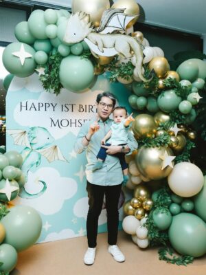 Sharifah Amani Instagram - A whole year with you. Happiest 1st Birthday best friend Mum & Bapak. ✨💚✨
Ya Allah Ya Rahman Ya Rahim,
We are grateful for every smile, every breath, every moment we have with our son Ahmed Mohsein. The grandson to our parents, the nephew to our brothers and sisters, the cousin to our nephews and nieces, the apple of our eye.
With deep gratitude. As a sign of our love and affection for him, we ask of You Allah, to bless him with a life filled with Your mercy, strong faith, a mind that’s thoughtful, good health, and endless sustenance that is pure and full of Your blessings.
Ya Allah Ya Ghafur Ya Wadud
Protect him always, in ways we see and ways we don’t. Fill his heart with faith, kindness, and courage. Let him grow into someone who brings good to others and walks a path that pleases You.
Grant him strength in hardship, humility in ease, and joy in worship. Surround him with love, guide his steps, and let him never feel alone.
Ya Allah Ya Karim Ya Razzaq
We entrust this prayer to You with full hope that You grant our dear one a noble character, unwavering determination, and high spirits. May his praiseworthy actions lead him to become a person who excels in this world and in the hereafter.
Bless the life of our Mohsein. Make him happy, and may his well-being radiate to bring peace and joy to his family and his faith.
And to Mohsein - Barakallah Fii Umrik, Semoga Allah memberkati usiamu.
Āmīn, Yā Rabbal-‘Ālamīn.
Doa by Bapak @med_faris
Backdrop by @babycakeshoppe
Cake by @brownandsyai
Pictures by @curicuriklik @atiqah9529
#MohseinTheDragonBanjai