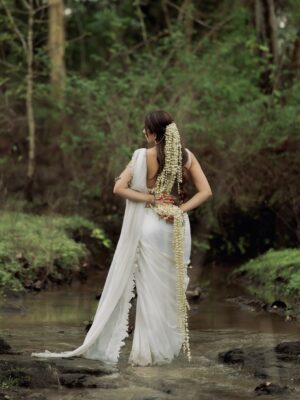Shivali Rijhwani Instagram - 🦢🪷
This look is built on the idea of “Purity meeting Depth” - a white saree symbolizing simplicity and calm, paired with natural elements. The gajra, the earthy tones of water and sky becomes the muse and the story.
From vision to reality - all thanks to my A-team. Styling – @stylistgurleenkaur
Photography – @snapbyte_ @look_book_by_snapbyte
