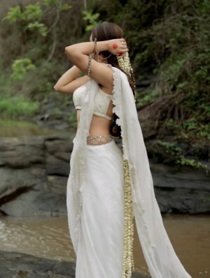 Shivali Rijhwani Instagram - 🦢🪷
This look is built on the idea of “Purity meeting Depth” - a white saree symbolizing simplicity and calm, paired with natural elements. The gajra, the earthy tones of water and sky becomes the muse and the story.
From vision to reality - all thanks to my A-team. Styling – @stylistgurleenkaur
Photography – @snapbyte_ @look_book_by_snapbyte