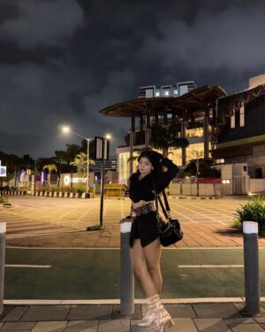 Simran D Sharma Instagram - City lights, silver boots, and no rules…. 🪩
.
.
#FashionInspo #OOTD #StyleGoals #TrendAlert #StreetStyle #InstaFashion #BootGameStrong #StatementLook #AllBlackFit #SkirtStyle #BoldFashion #ChicAndSassy