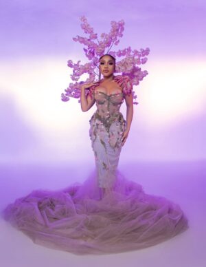 Thando Thabethe Instagram - A love letter to South Africa’s soul — where valleys cradle winding rivers, mountains rise in quiet majesty, and the sky bursts into purple and orange at sunset. Inspired by the rich textures of indigenous flora and the rhythm of the land itself, every detail reflects the beauty and grace of a country where nature speaks in color and movement.🌸🌸🌸
#marvelsofmzansi
#durbanjuly2025
#HDJ2025 #hdjmarvelsofmzansi #feelthepulse
Glam: @thepenthousebeautystudio
Photography: @aust_malema
Dress: @willetdesignscouture