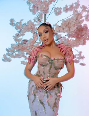 Thando Thabethe Instagram - A love letter to South Africa’s soul — where valleys cradle winding rivers, mountains rise in quiet majesty, and the sky bursts into purple and orange at sunset. Inspired by the rich textures of indigenous flora and the rhythm of the land itself, every detail reflects the beauty and grace of a country where nature speaks in color and movement.🌸🌸🌸
#marvelsofmzansi
#durbanjuly2025
#HDJ2025 #hdjmarvelsofmzansi #feelthepulse
Glam: @thepenthousebeautystudio
Photography: @aust_malema
Dress: @willetdesignscouture
