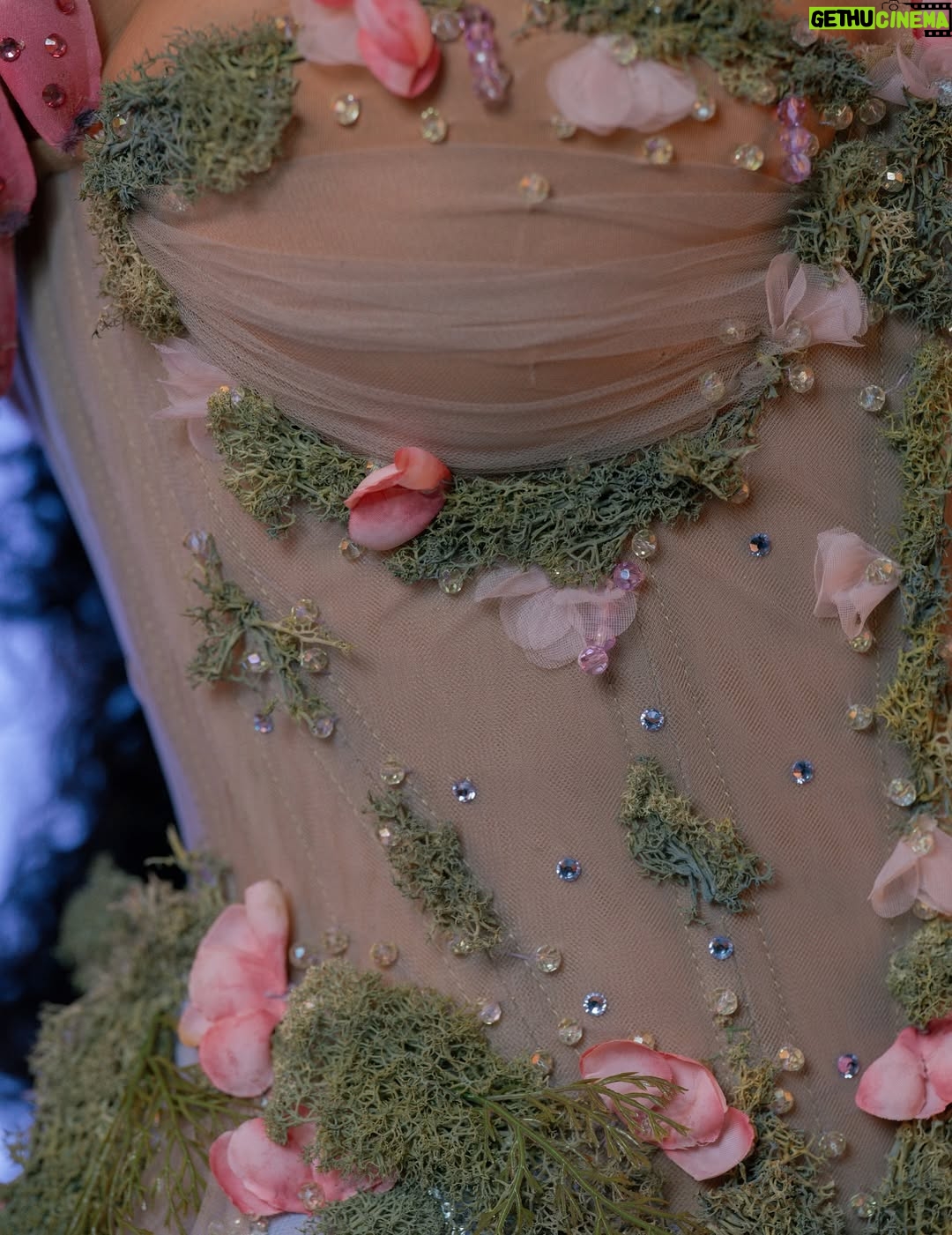 Thando Thabethe - 105.9K Likes - A love letter to South Africa’s soul — where valleys cradle winding rivers, mountains rise in quiet majesty, and the sky bursts into purple and orange at sunset. Inspired by the rich textures of indigenous flora and the rhythm of the land itself, every detail reflects the beauty and grace of a country where nature speaks in color and movement.🌸🌸🌸
#marvelsofmzansi
#durbanjuly2025 
#HDJ2025 #hdjmarvelsofmzansi #feelthepulse 

Glam: @thepenthousebeautystudio 
Photography: @aust_malema 
Dress: @willetdesignscouture
