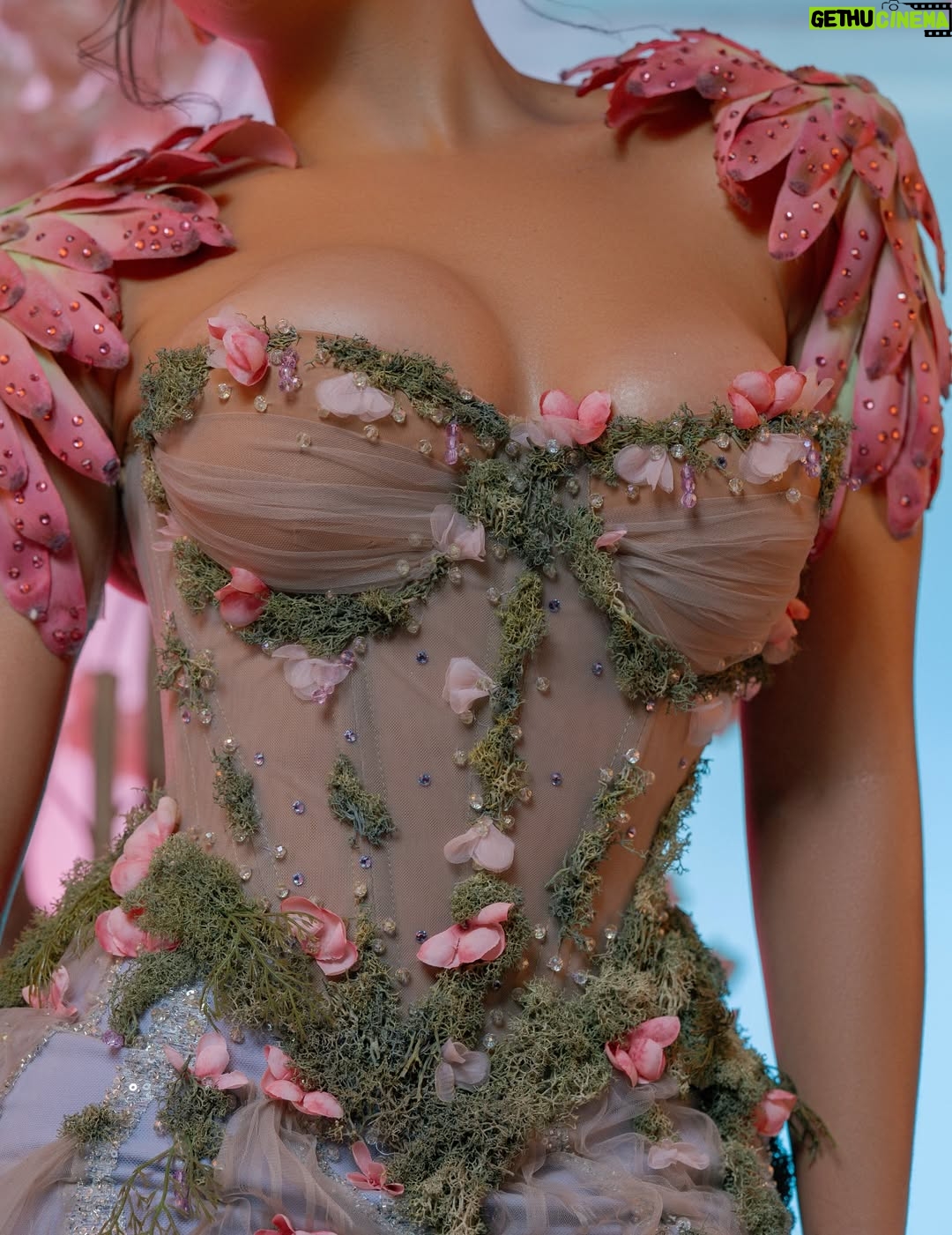 Thando Thabethe - 105.9K Likes - A love letter to South Africa’s soul — where valleys cradle winding rivers, mountains rise in quiet majesty, and the sky bursts into purple and orange at sunset. Inspired by the rich textures of indigenous flora and the rhythm of the land itself, every detail reflects the beauty and grace of a country where nature speaks in color and movement.🌸🌸🌸
#marvelsofmzansi
#durbanjuly2025 
#HDJ2025 #hdjmarvelsofmzansi #feelthepulse 

Glam: @thepenthousebeautystudio 
Photography: @aust_malema 
Dress: @willetdesignscouture