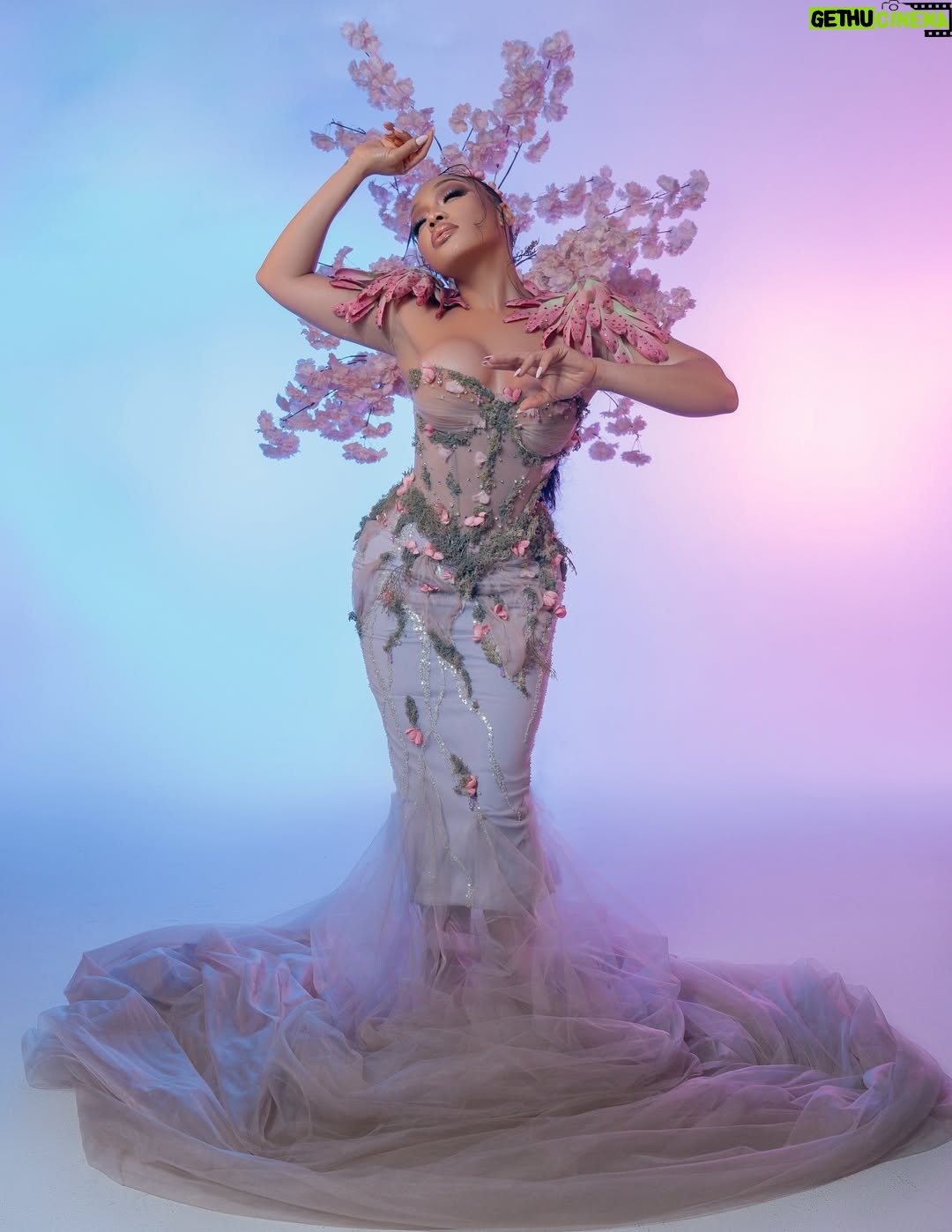 Thando Thabethe - 105.9K Likes - A love letter to South Africa’s soul — where valleys cradle winding rivers, mountains rise in quiet majesty, and the sky bursts into purple and orange at sunset. Inspired by the rich textures of indigenous flora and the rhythm of the land itself, every detail reflects the beauty and grace of a country where nature speaks in color and movement.🌸🌸🌸
#marvelsofmzansi
#durbanjuly2025 
#HDJ2025 #hdjmarvelsofmzansi #feelthepulse 

Glam: @thepenthousebeautystudio 
Photography: @aust_malema 
Dress: @willetdesignscouture