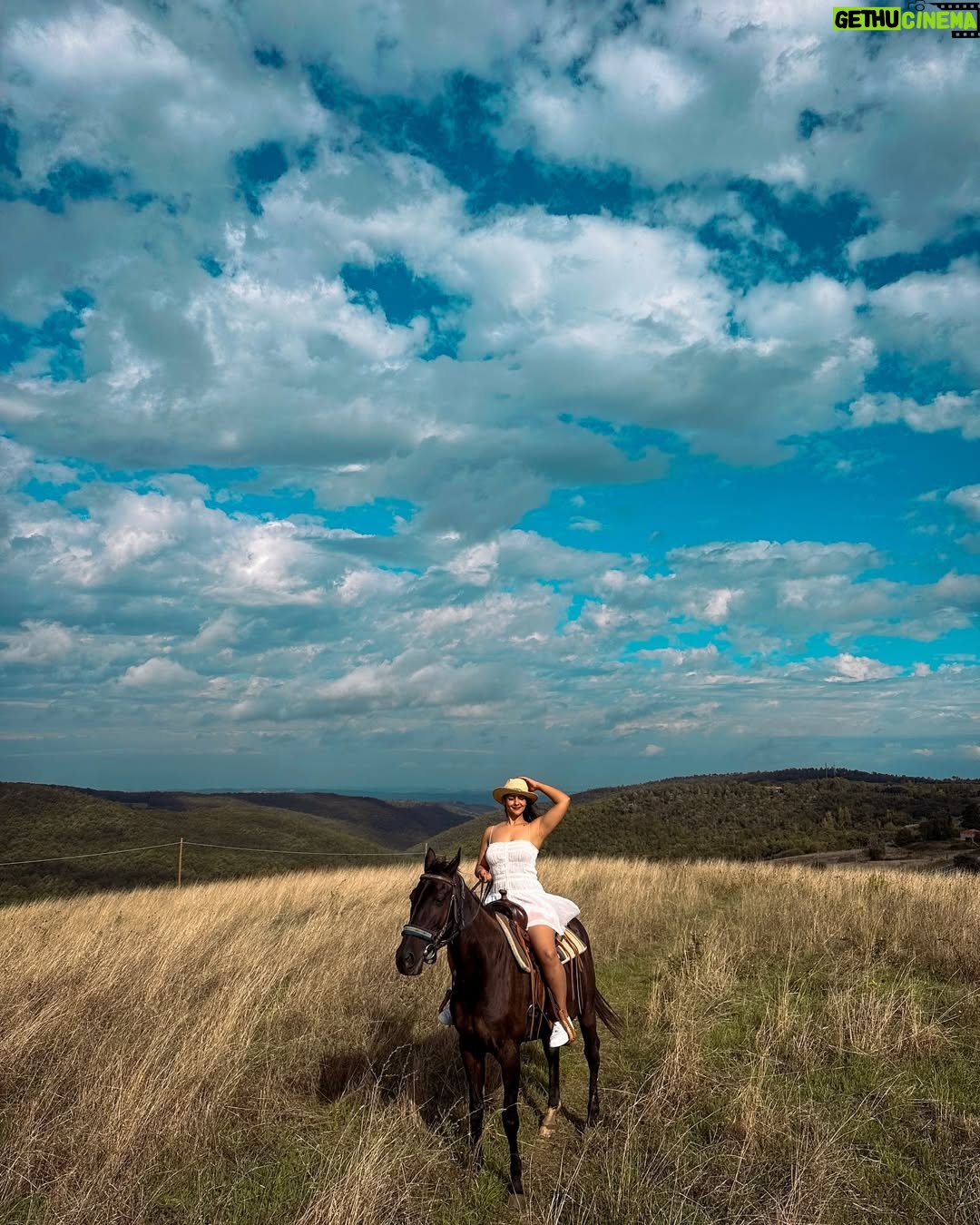 diksha sharma - 7.8K Likes - 📍Tuscany, Italy
The day life looked like a painting..
Rolling hills met endless skies..
The sun shone and how..

Living my Tuscan dream one gallop at a time :)
This is from my stay in Tuscany where about 18 horses are lovingly being bred and we got a chance to spend a day with them, ride the tuscan hills and see the beauty of it all!

I am wearing @thrift.save.rave dress!

#banjara #banjaratravels #banjarainitaly
.
.
.
[Tuscany, Italy, Tuscan Countryside, Agriturismo, Tuscany Itinerary, explore tuscany, visit italy, explore italy, riding in tuscany, horseback riding, travel goals, road trip, travel inspiration]