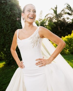 Amina Khalil Instagram - On the most important day of her life, #AminaKhalil stepped into her forever, surrounded by towering palms and a sea of white. For this deeply personal celebration, she wears a custom creation by Maison Yeya: a modern interpretation of a timeless princess silhouette. Designed by Yasmine Yeya, the gown sculpted her figure before cascading into voluminous layers of triple silk gazar, delicately embroidered at the hem. Captured exclusively for Vogue Arabia, the first glimpse of an Egyptian actress revealing a modern bridal vision.

في أهم يومٍ في حياتها، أطلت أمينة خليل كحلمٍ محاطةً بسحر النخيل الباسق ونقاء الأبيض الناصع. لحفلها زفافها، تألقت أمينة بفستان من "ميزون يحيى"، صُمم خصيصًا ليجعل منها أميرةً عصريةً خالدة. احتضن الفستان، الذي أبدعت ياسمين يحيى بتصميمه، قوامها قبل أن يتدفق على طبقاتٍ شاسعة من الغازار الحريري، مطرزًا بدقةٍ عند الأطراف. وفي صورٍ حصرية لمجلة ڤوغ العربية، تلوح أول لمحةٍ لممثلةٍ مصريةٍ تكشف رؤيةٍ عصريةٍ لفساتين الزفاف.

Photography: @lamismagdy 
Stylist: @mohamedashraff
Makeup: @Itsnohathemua
Hair: @kimisafadi 
Dress: @maisonyeya 
Shoes: @jimmychoo 
Jewellery: @elkadyjewelry 
Event planning: @vertex.events 

#VogueArabia