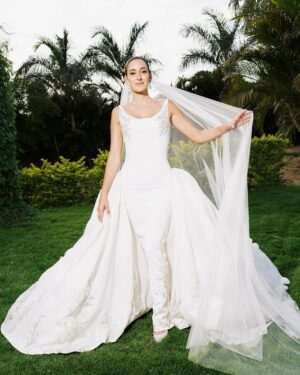Amina Khalil Instagram - On the most important day of her life, #AminaKhalil stepped into her forever, surrounded by towering palms and a sea of white. For this deeply personal celebration, she wears a custom creation by Maison Yeya: a modern interpretation of a timeless princess silhouette. Designed by Yasmine Yeya, the gown sculpted her figure before cascading into voluminous layers of triple silk gazar, delicately embroidered at the hem. Captured exclusively for Vogue Arabia, the first glimpse of an Egyptian actress revealing a modern bridal vision.

في أهم يومٍ في حياتها، أطلت أمينة خليل كحلمٍ محاطةً بسحر النخيل الباسق ونقاء الأبيض الناصع. لحفلها زفافها، تألقت أمينة بفستان من "ميزون يحيى"، صُمم خصيصًا ليجعل منها أميرةً عصريةً خالدة. احتضن الفستان، الذي أبدعت ياسمين يحيى بتصميمه، قوامها قبل أن يتدفق على طبقاتٍ شاسعة من الغازار الحريري، مطرزًا بدقةٍ عند الأطراف. وفي صورٍ حصرية لمجلة ڤوغ العربية، تلوح أول لمحةٍ لممثلةٍ مصريةٍ تكشف رؤيةٍ عصريةٍ لفساتين الزفاف.

Photography: @lamismagdy 
Stylist: @mohamedashraff
Makeup: @Itsnohathemua
Hair: @kimisafadi 
Dress: @maisonyeya 
Shoes: @jimmychoo 
Jewellery: @elkadyjewelry 
Event planning: @vertex.events 

#VogueArabia