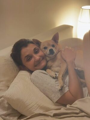 Anjali Bhimani Instagram - Have needed time before sharing, but it’s not gonna get any easier to write this, so here goes. My heart is broken into a thousand pieces. The Mayor of Doggo now has an aureate glow. We’ll still sing his song here on Earth while the dogs in Doggo sing it at his daily parade. Because we love him the mostest, the mostest of all. 

Oh sweet sweet boy,

From the moment I saw you 15 years ago - little nugget, little man - when you pranced over and into my heart, it was love at first sight. Then, a month or so later when you met your papa, it was love at first sight for him too (even though it took the him and me a while longer for us to realize we were going to be your pawrents together). You healed my heart when it was broken before you, and I know you will heal both mine and Papa Dog’s again from where you are by sending memories to us throughout every day. We’re going to keep working hard to make you proud down here, carrying on the work you inspired us to start with the Puppy Roll in the land of Doggo and with I Am Fun Size and with our writing and our videos and all the plans we had and have to make more together …but most of all, I’m so grateful for the way you taught me to love - to love others and love myself. I’m a better human because of your gentle, insistent love, your licks, your silliness, your cleverness, your snuggles, your derpy tongue, the way your perfect little head fit in the crook of my neck, your tiny paws, and everything you were to me and to us while you were with us in this realm. Please send a sending bone from where you are now and then, even if it’s just in my dreams. When I’m sleeping, and when Papa is too, we can all dream that the pack is back until we all get to snuggle together again. 

#charleythebestdog