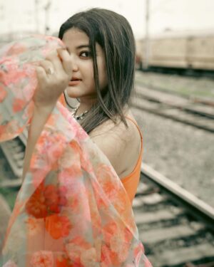 Asmee Ghosh Instagram - In a world that never stops moving, I chose to pause to lean into my own rhythm, to stand boldly where stories pass and silence speaks louder than noise. Draped in hues, wrapped in grace, I’m not waiting for a train, a sign, or permission! just owning the tracks I walk and the fire I carry. I don’t blend in with the blur, I break it. While the world rushes past, I stand still, sharp, and unbothered. Against cracked walls and iron rails, I wear my fire loud and my silence louder. This isn’t softness, it’s strength wrapped in calm. I’m not here to be delicate. I’m here to be unforgettable. Watch the train pass. I’ll still be standing. Rooted to the earth. Miles to go before I sleep….

Behind the lens @swaratghosh 🧡