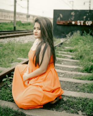 Asmee Ghosh Instagram - In a world that never stops moving, I chose to pause to lean into my own rhythm, to stand boldly where stories pass and silence speaks louder than noise. Draped in hues, wrapped in grace, I’m not waiting for a train, a sign, or permission! just owning the tracks I walk and the fire I carry. I don’t blend in with the blur, I break it. While the world rushes past, I stand still, sharp, and unbothered. Against cracked walls and iron rails, I wear my fire loud and my silence louder. This isn’t softness, it’s strength wrapped in calm. I’m not here to be delicate. I’m here to be unforgettable. Watch the train pass. I’ll still be standing. Rooted to the earth. Miles to go before I sleep….

Behind the lens @swaratghosh 🧡