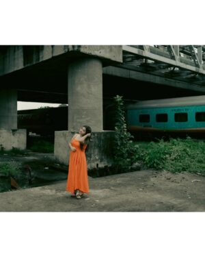 Asmee Ghosh Instagram - In a world that never stops moving, I chose to pause to lean into my own rhythm, to stand boldly where stories pass and silence speaks louder than noise. Draped in hues, wrapped in grace, I’m not waiting for a train, a sign, or permission! just owning the tracks I walk and the fire I carry. I don’t blend in with the blur, I break it. While the world rushes past, I stand still, sharp, and unbothered. Against cracked walls and iron rails, I wear my fire loud and my silence louder. This isn’t softness, it’s strength wrapped in calm. I’m not here to be delicate. I’m here to be unforgettable. Watch the train pass. I’ll still be standing. Rooted to the earth. Miles to go before I sleep….

Behind the lens @swaratghosh 🧡