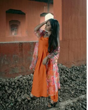 Asmee Ghosh Instagram - In a world that never stops moving, I chose to pause to lean into my own rhythm, to stand boldly where stories pass and silence speaks louder than noise. Draped in hues, wrapped in grace, I’m not waiting for a train, a sign, or permission! just owning the tracks I walk and the fire I carry. I don’t blend in with the blur, I break it. While the world rushes past, I stand still, sharp, and unbothered. Against cracked walls and iron rails, I wear my fire loud and my silence louder. This isn’t softness, it’s strength wrapped in calm. I’m not here to be delicate. I’m here to be unforgettable. Watch the train pass. I’ll still be standing. Rooted to the earth. Miles to go before I sleep….

Behind the lens @swaratghosh 🧡
