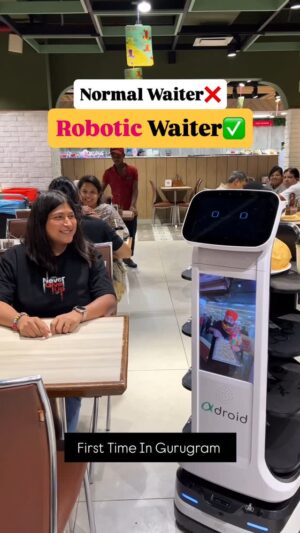Bhawna Singla Instagram - First Time In Gurugram ❤️❤️
#gurugram #robot #robotic #gurugrammers #omsweet #om #veg #pureveg #waiter #humanwaiter #machinewaiter #robotwaiter #cafeholic