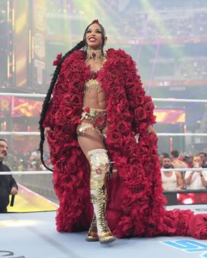 Bianca Crawford Instagram - Gear & Entrance Piece: MADE BY ME
greatEST Gear of ALL TIME
🌹🌹🌹🌹🌹🌹
When I was a little girl my Mama asked me what I wanted to be when I grew up and I said “I want people to throw roses at my feet”.she was confused, but we eventually realized I saw someone on tv performing; receiving a round of applause as people threw roses on stage. Basically, I was saying I wanted to perform. I wanted to entertain. I wanted to pour so much of myself into something that it would make people feel so much and have them jumping to their feet! When you work hard and succeed (success is your own definition) you will get your flowers!

I’ve poured so much of myself into what I do. I love what I do. I’m GREAT at what I do, but that doesn’t mean I don’t get tired, frustrated, overwhelmed, burnt out… I work my ASS off INSIDE AND OUTSIDE the ring because I want to be remembered as someone who earned and deserved EVERYTHING they have gotten, I want to be remembered as someone who entertained you and made you feel something, I want to be remembered as an innovator never duplicator, a trendsetter, and history maker, a one of a kind generational talent that makes a difference in an impactful way and changed the game.
Win or lose I love what I do. Win or lose I’m always proud of the body of work WE do. And win or lose I’ll never let up.

My family has always been my biggest supporters and they have always been with me every step of the way. this #wrESTleMania was special because they were even out there with me.  My step daughter was in my entrance jump roping with her braid. I almost broke hugging her and my parents and husband were with me in my entrance. I was so overwhelmed with time and making my gear. My parents flew down on my bday and we all collectively made this entrance piece. It was a full circle moment of telling my Mama I want people to throw roses at my feet as a kid to now being in WWE and having my mama & daddy toss roses to me & @montezfordwwe as we tag teamed to make this piece. 
I’m walking in my purpose and damn it win or lose cheers or boos “it is what it is”. WE did that yesterday and I’ll be damned if I didn’t get my flowers!
#ESTofWWE